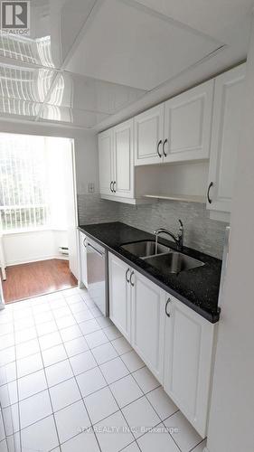 305 - 550 Webb Drive, Mississauga, ON - Indoor Photo Showing Kitchen With Double Sink