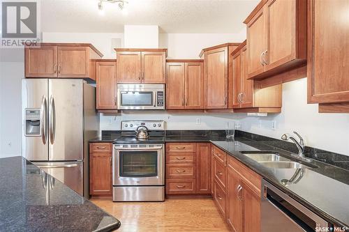 304 401 Cartwright Street, Saskatoon, SK - Indoor Photo Showing Kitchen With Double Sink