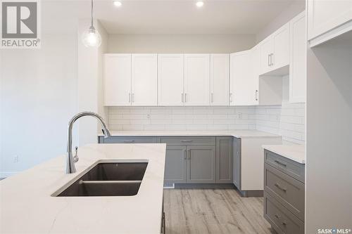 26 625 Dagnone Crescent, Saskatoon, SK - Indoor Photo Showing Kitchen With Double Sink