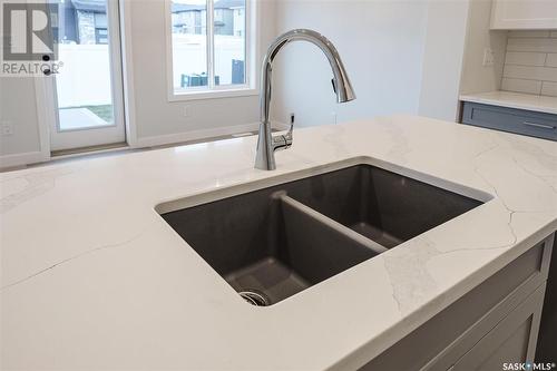 26 625 Dagnone Crescent, Saskatoon, SK - Indoor Photo Showing Kitchen With Double Sink