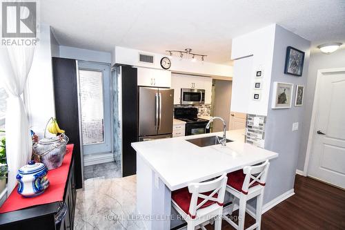 #203 -4 Elsinore Path, Toronto, ON - Indoor Photo Showing Kitchen With Stainless Steel Kitchen