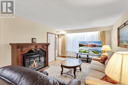 9 Riverside Crescent, Wasaga Beach, ON - Indoor Photo Showing Living Room With Fireplace