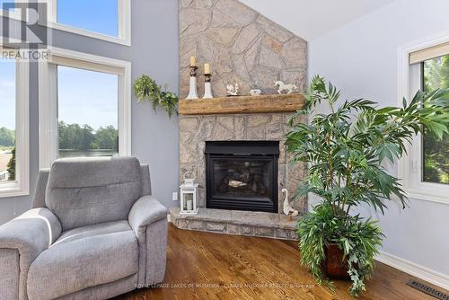 49 Mintens Lane E, Georgian Bay, ON - Indoor Photo Showing Living Room With Fireplace