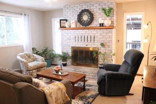 2782 20Th Street, Lister, BC - Indoor Photo Showing Living Room With Fireplace