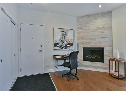Hall - 101-50 Rue Lemieux, Granby, QC - Indoor With Fireplace