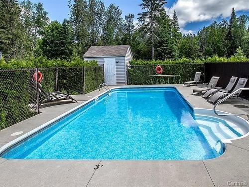 102-1692 Boul. Pie-Xi N., Québec (La Haute-Saint-Charles), QC - Outdoor With In Ground Pool With Backyard
