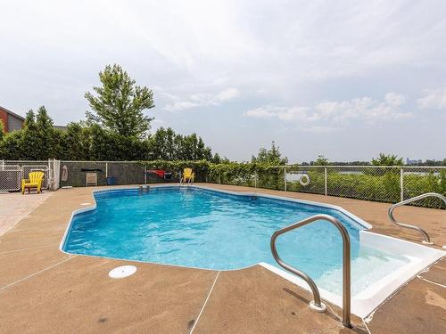 Pool - 716-7680 Boul. Marie-Victorin, Brossard, QC - Outdoor With In Ground Pool With Backyard