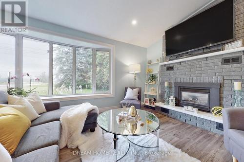 8774 Wellington Rd 5, Minto, ON - Indoor Photo Showing Living Room With Fireplace