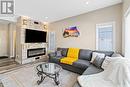 40 115 Veltkamp Crescent, Saskatoon, SK  - Indoor Photo Showing Living Room With Fireplace 