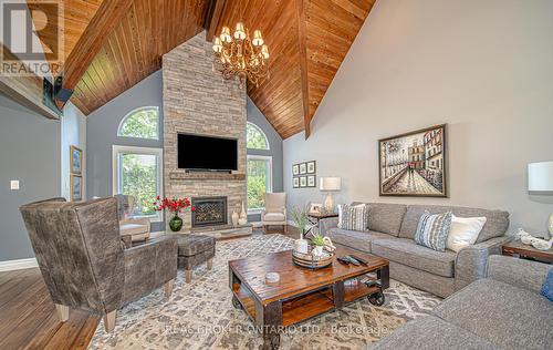5 Ploughshare Crt, Algonquin Highlands, ON - Indoor Photo Showing Living Room With Fireplace