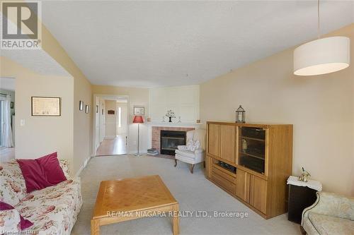 7715 Swan St, Niagara Falls, ON - Indoor Photo Showing Living Room With Fireplace