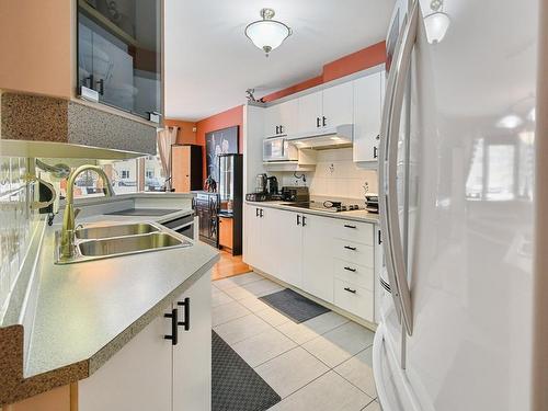 Kitchen - 2600  - 202 Boul. René-Laennec, Laval (Vimont), QC - Indoor Photo Showing Kitchen With Double Sink