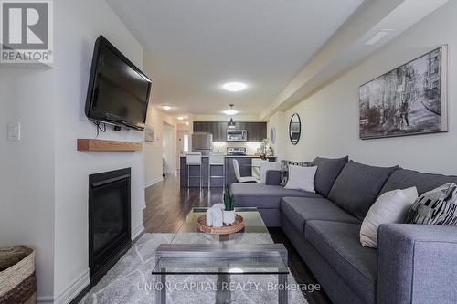 #205 -6 Anchorage Cres, Collingwood, ON - Indoor Photo Showing Living Room With Fireplace
