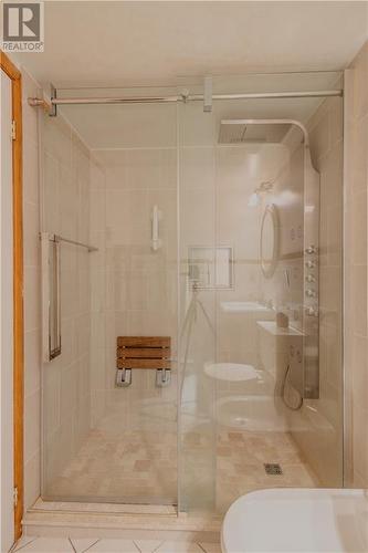 Luxury meets relaxation with this tastefully updated bathroom featuring a Rain & Waterfall shower! - 5 Huron Avenue N, Ottawa, ON - Indoor Photo Showing Bathroom