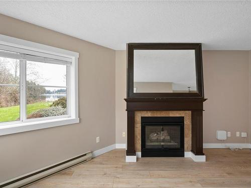 118-4969 Wills Rd, Nanaimo, BC - Indoor Photo Showing Living Room With Fireplace