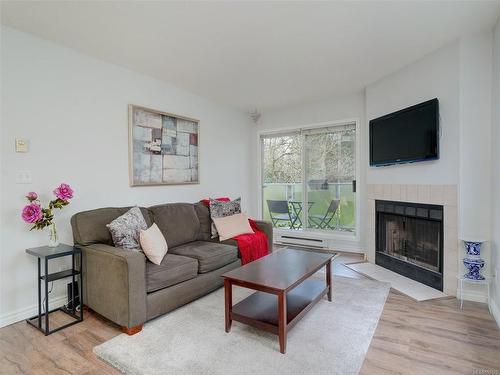 308-2520 Wark St, Victoria, BC - Indoor Photo Showing Living Room With Fireplace