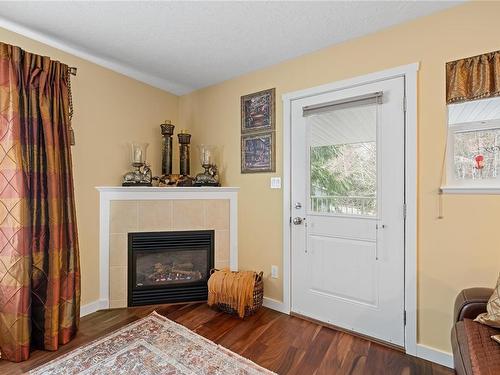 1688 Lailah'S Loop, Qualicum Beach, BC - Indoor Photo Showing Living Room With Fireplace
