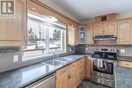4924 Gloinnzun Drive, 108 Mile Ranch, BC - Indoor Photo Showing Kitchen With Double Sink