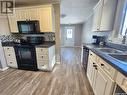 11 9Th Street, Weyburn, SK  - Indoor Photo Showing Kitchen With Double Sink 