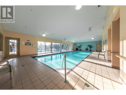 595 Yates Road Unit# 432, Kelowna, BC - Indoor Photo Showing Other Room With In Ground Pool