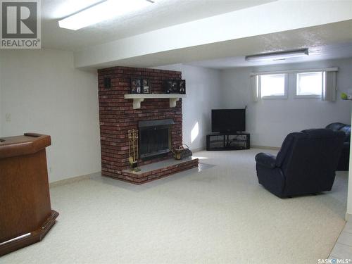 200 Barsness Street, Richmound, SK - Indoor Photo Showing Other Room With Fireplace