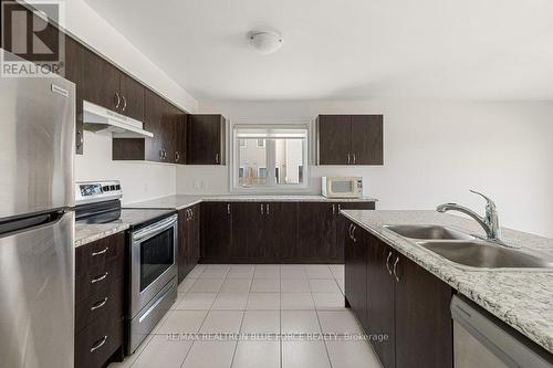 50 Brennan Crescent, Loyalist, ON - Indoor Photo Showing Kitchen With Double Sink With Upgraded Kitchen