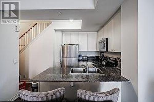 #Th9 -145 Long Branch Ave, Toronto, ON - Indoor Photo Showing Kitchen With Stainless Steel Kitchen With Upgraded Kitchen