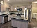 104 Carlyle Avenue, Carlyle, SK  - Indoor Photo Showing Kitchen With Double Sink 