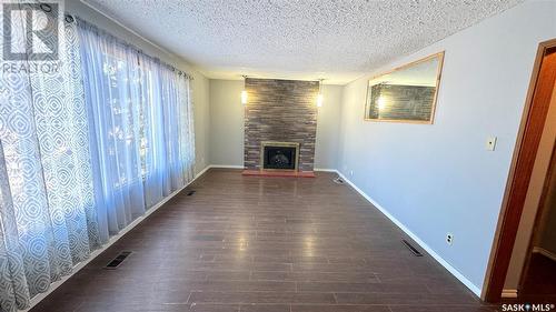 435 8Th Street E, Prince Albert, SK - Indoor Photo Showing Other Room With Fireplace