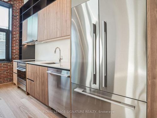 403-150 Logan Ave, Toronto, ON - Indoor Photo Showing Kitchen With Stainless Steel Kitchen