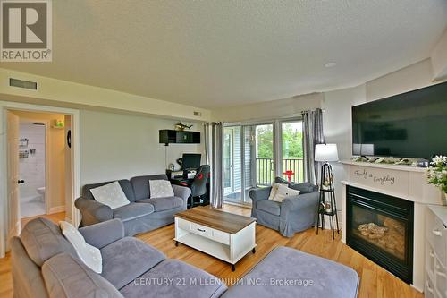 #10 -20 Mulligan Lane, Wasaga Beach, ON - Indoor Photo Showing Living Room With Fireplace