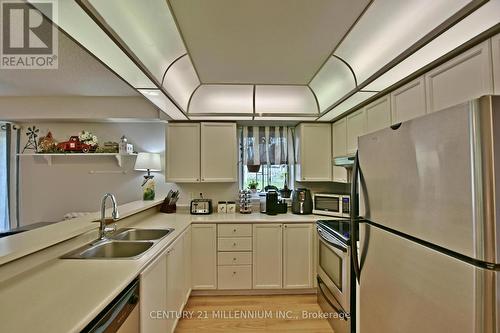 #10 -20 Mulligan Lane, Wasaga Beach, ON - Indoor Photo Showing Kitchen With Double Sink