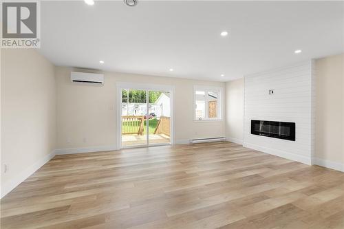 98 Ernest Street, Dieppe, NB - Indoor Photo Showing Living Room With Fireplace