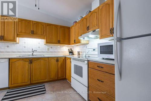 305 - 56 Tripp Boulevard, Quinte West, ON - Indoor Photo Showing Kitchen With Double Sink