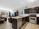 202-1350 Ridgeway Drive, Kelowna, BC  - Indoor Photo Showing Kitchen With Double Sink 