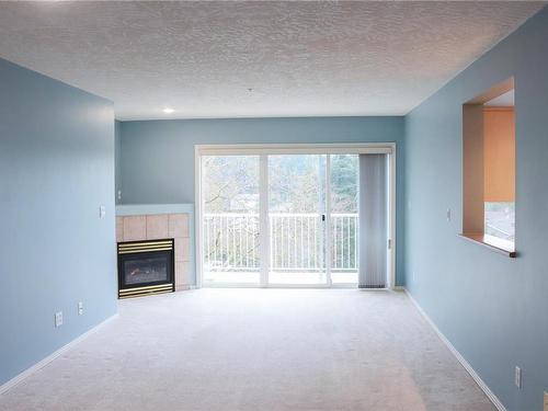 404-1240 Verdier Ave, Central Saanich, BC - Indoor Photo Showing Other Room With Fireplace