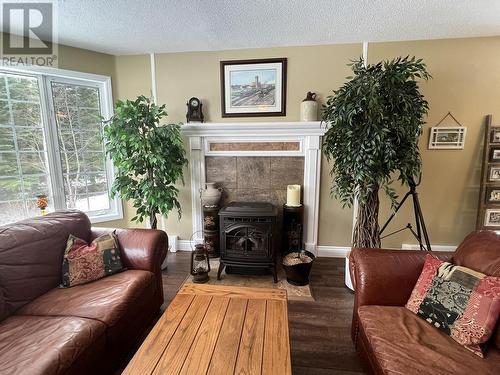 8639 Kroeker Road, Smithers, BC - Indoor Photo Showing Living Room With Fireplace
