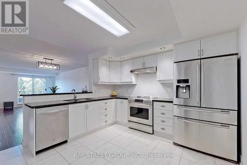 233 - 1881 Mcnicoll Avenue, Toronto, ON - Indoor Photo Showing Kitchen With Stainless Steel Kitchen