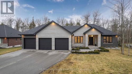 7 Walter James Pkwy, Springwater, ON - Outdoor With Facade