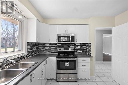 134 Victor Blvd, Hamilton, ON - Indoor Photo Showing Kitchen With Double Sink