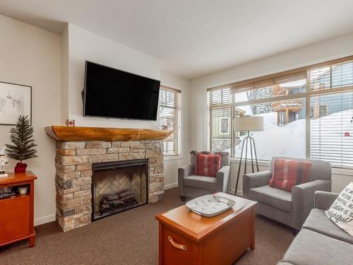 224-255 Feathertop Way, Big White, BC - Indoor Photo Showing Living Room With Fireplace