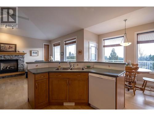 2537 Rhinestone Road, West Kelowna, BC - Indoor Photo Showing Kitchen With Fireplace With Double Sink