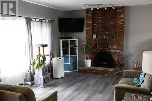 8255 Flamingo Road, Prince George, BC - Indoor Photo Showing Living Room With Fireplace