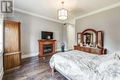 35 Eiffel Boulevard, Brampton, ON - Indoor Photo Showing Bedroom With Fireplace