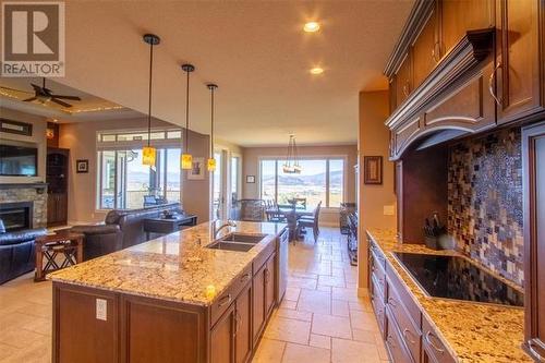5071 Lipkovits Road, Kelowna, BC - Indoor Photo Showing Kitchen With Fireplace With Double Sink
