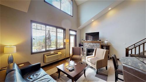 732 C - 700 Bighorn Boulevard, Radium Hot Springs, BC - Indoor Photo Showing Living Room With Fireplace