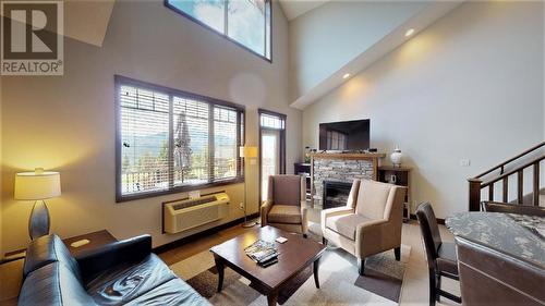 700 Bighorn  Boulevard Unit# 732 C, Radium Hot Springs, BC - Indoor Photo Showing Living Room With Fireplace