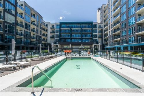 16 Concord Place|Unit #711, Grimsby, ON - Outdoor With In Ground Pool