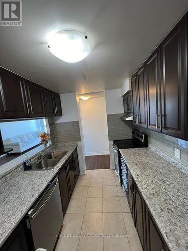 404 - 25 Trailwood Drive, Mississauga, ON - Indoor Photo Showing Kitchen With Double Sink