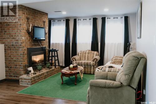 10 Barnes Crescent, Humboldt, SK - Indoor Photo Showing Living Room With Fireplace